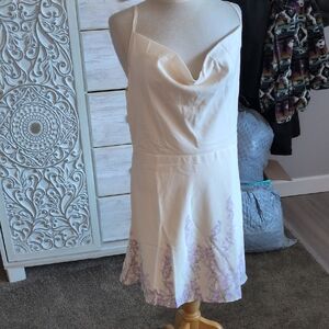 Elegant Cream Dress with Purple Floral Accents
